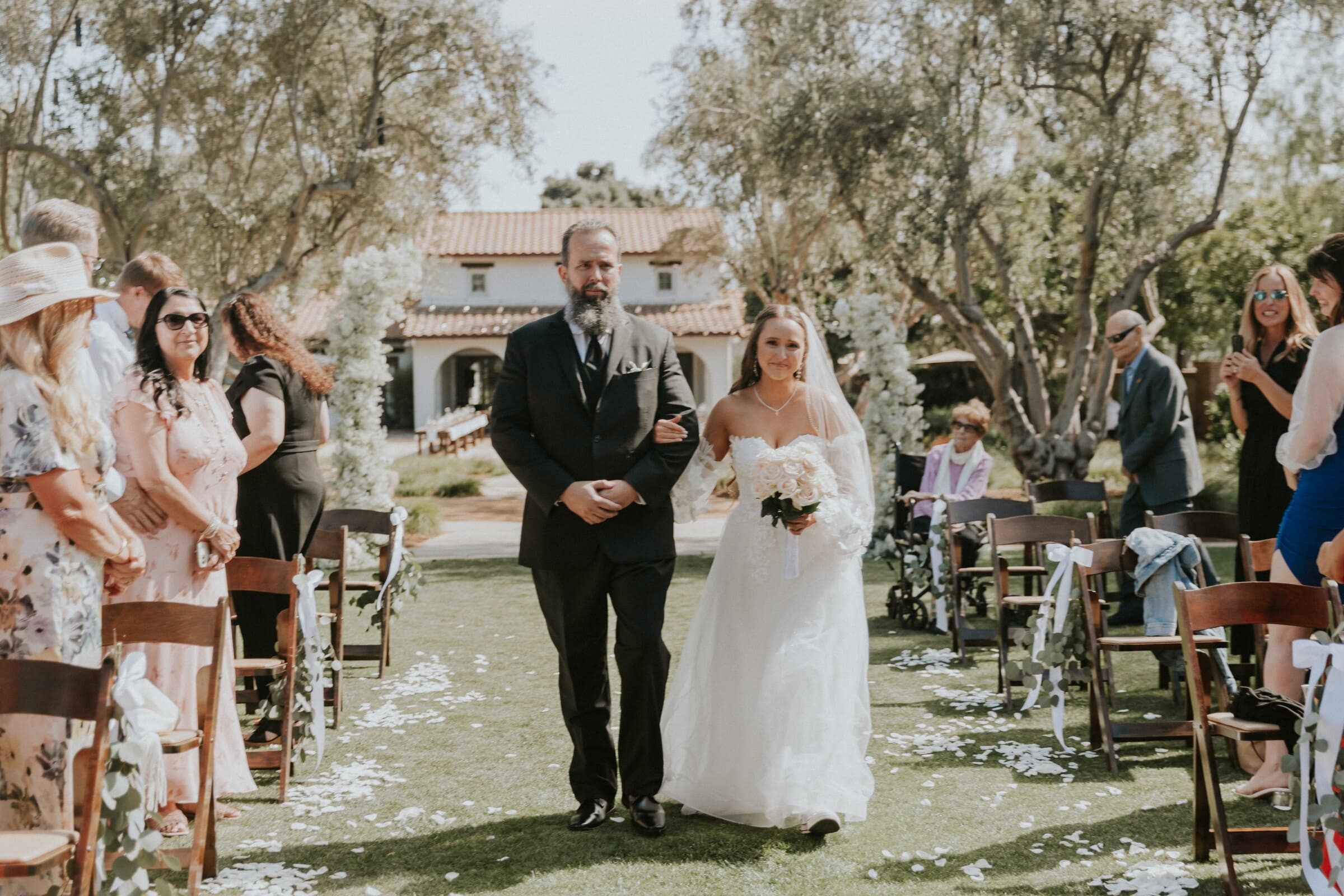 Irelyn coming down the aisle on the lawn