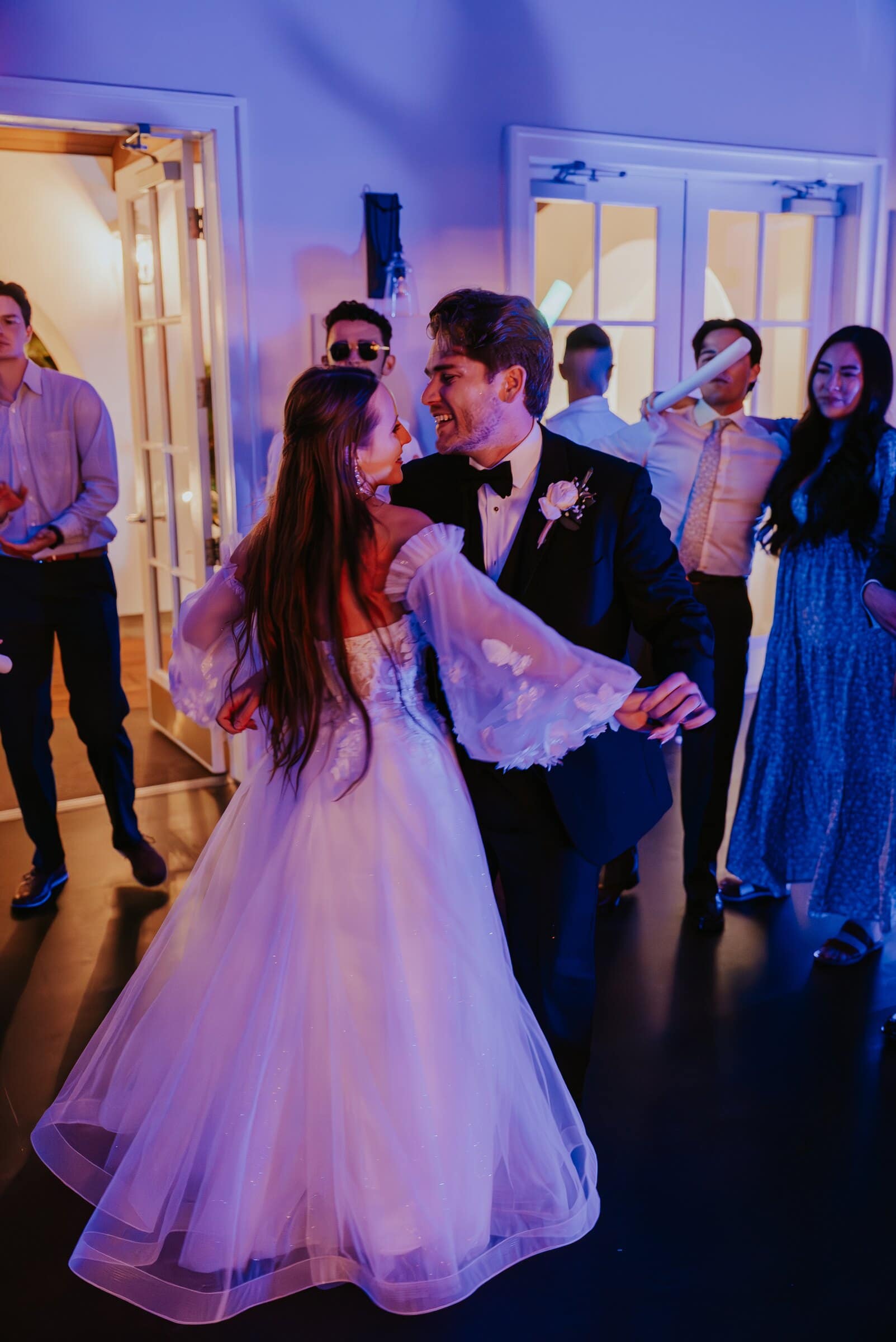 Irelyn's gown swirling as she and Aleck dance