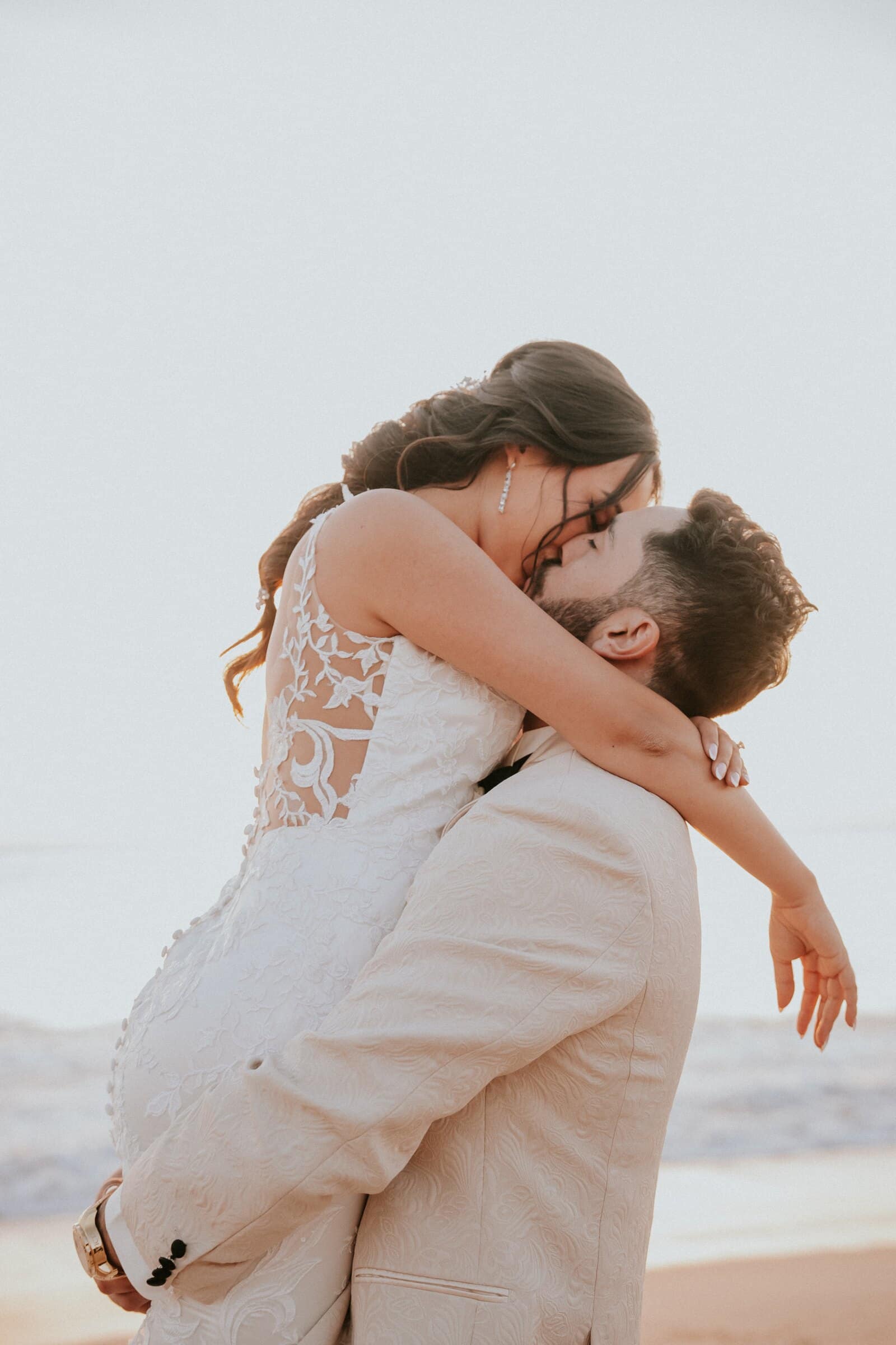 Dom lifting Ariana on the beach