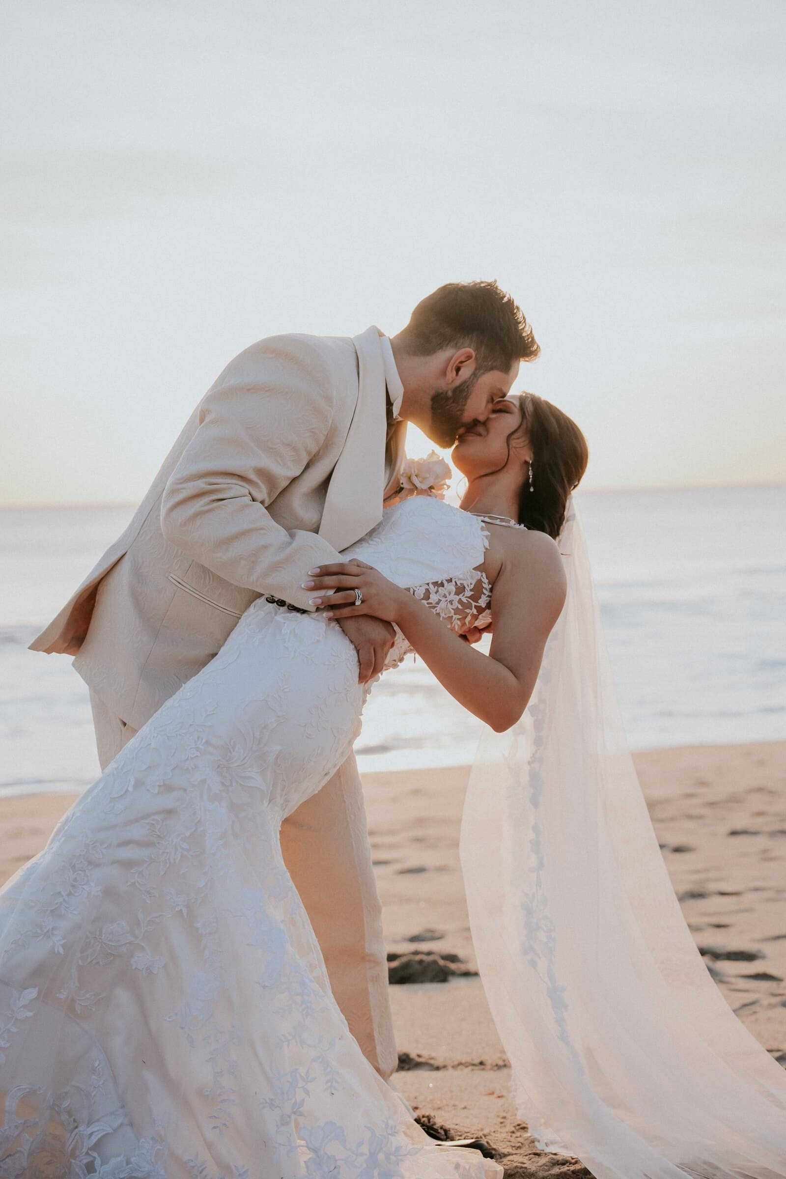 Dom dipping Ariana for a kiss on the beach