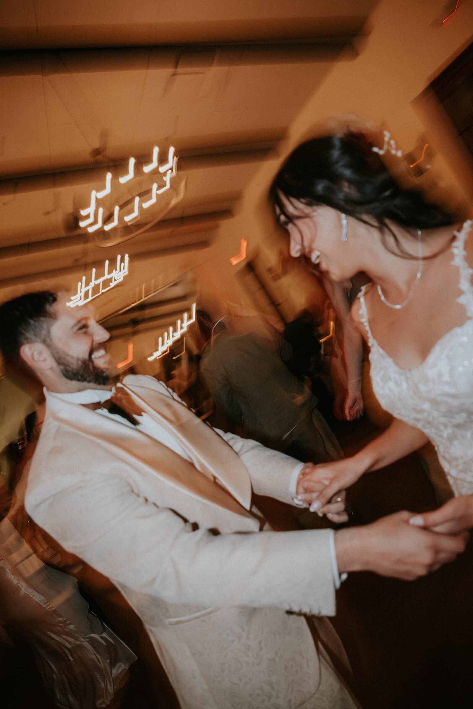 Dom spinning Ariana across the dance floor in a blur of light