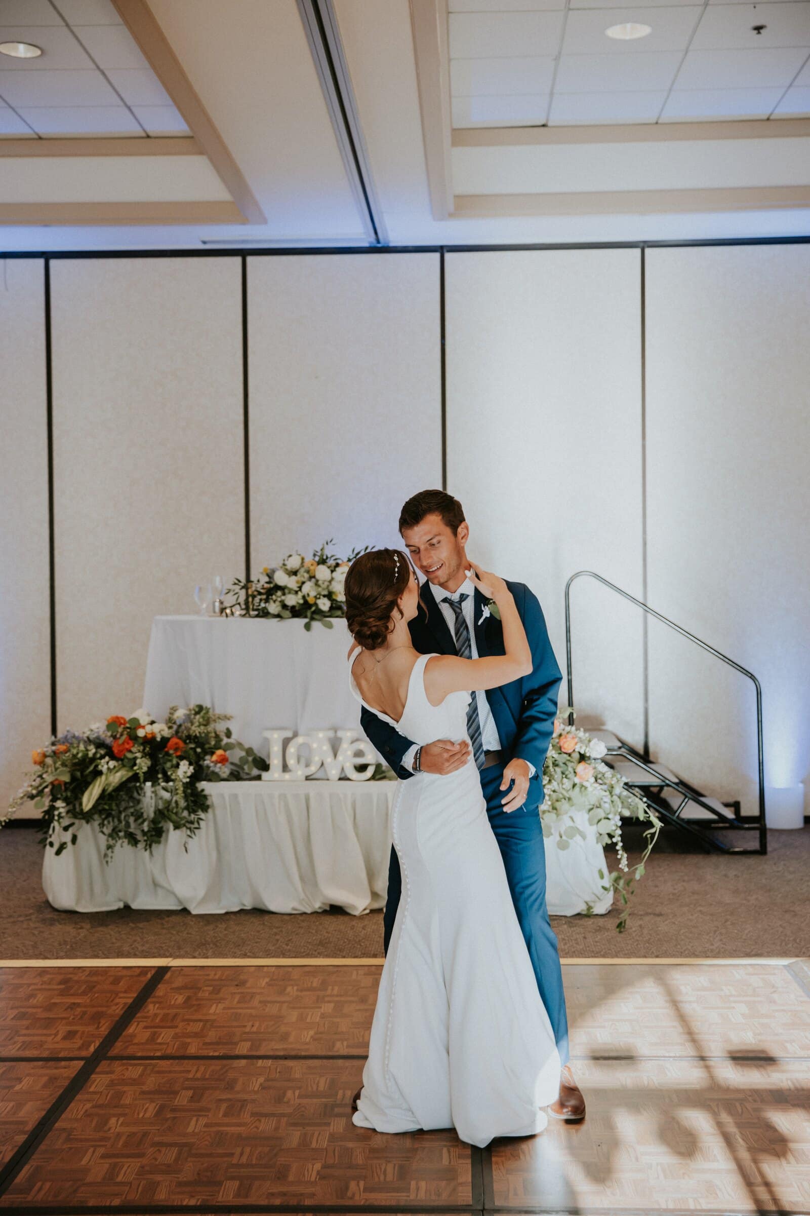 Claire holding Bryce's face during their first dance
