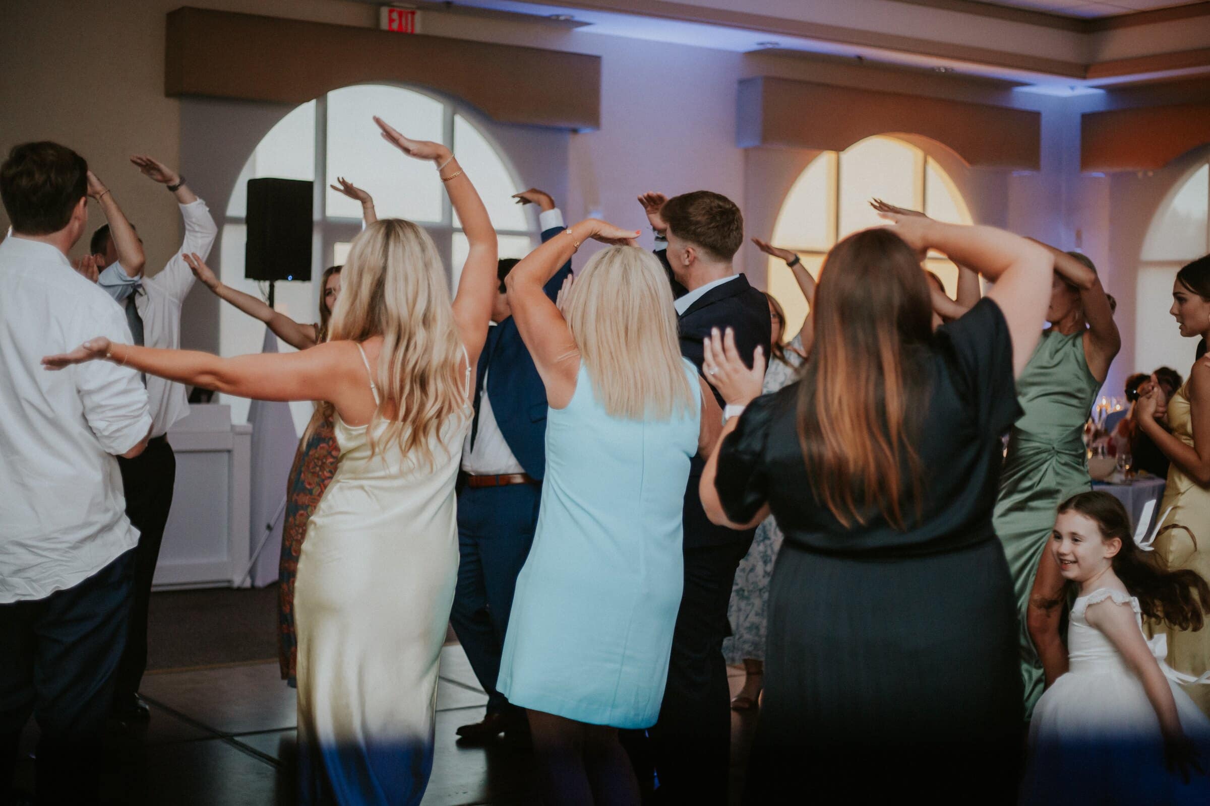Guests dancing with their arms raised