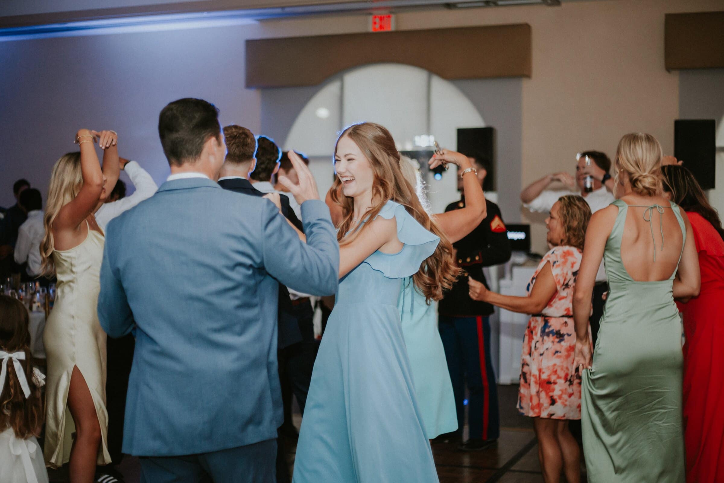 Friends dancing together in the reception hall
