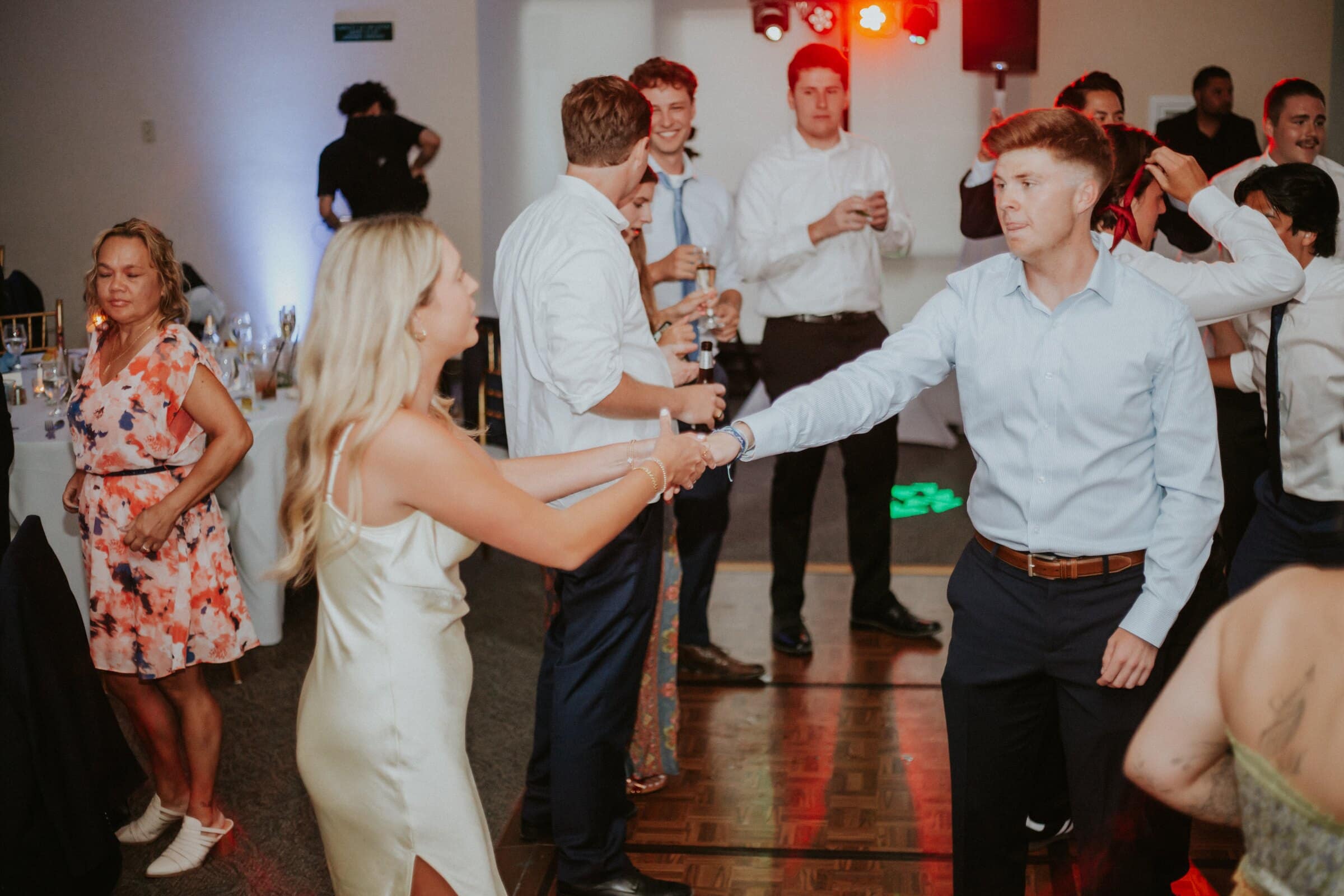 Guests twirling each other on the dance floor