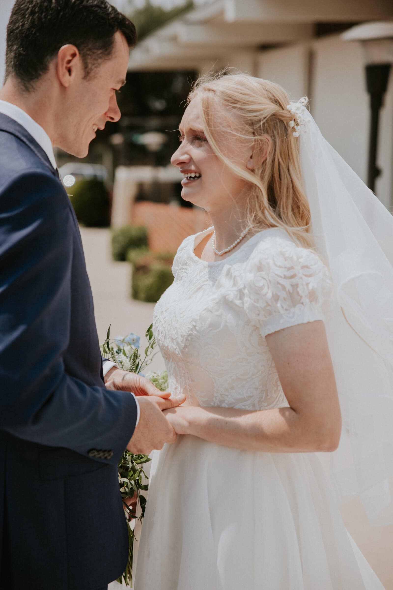 Bryce and Morgan holding hands and laughing
