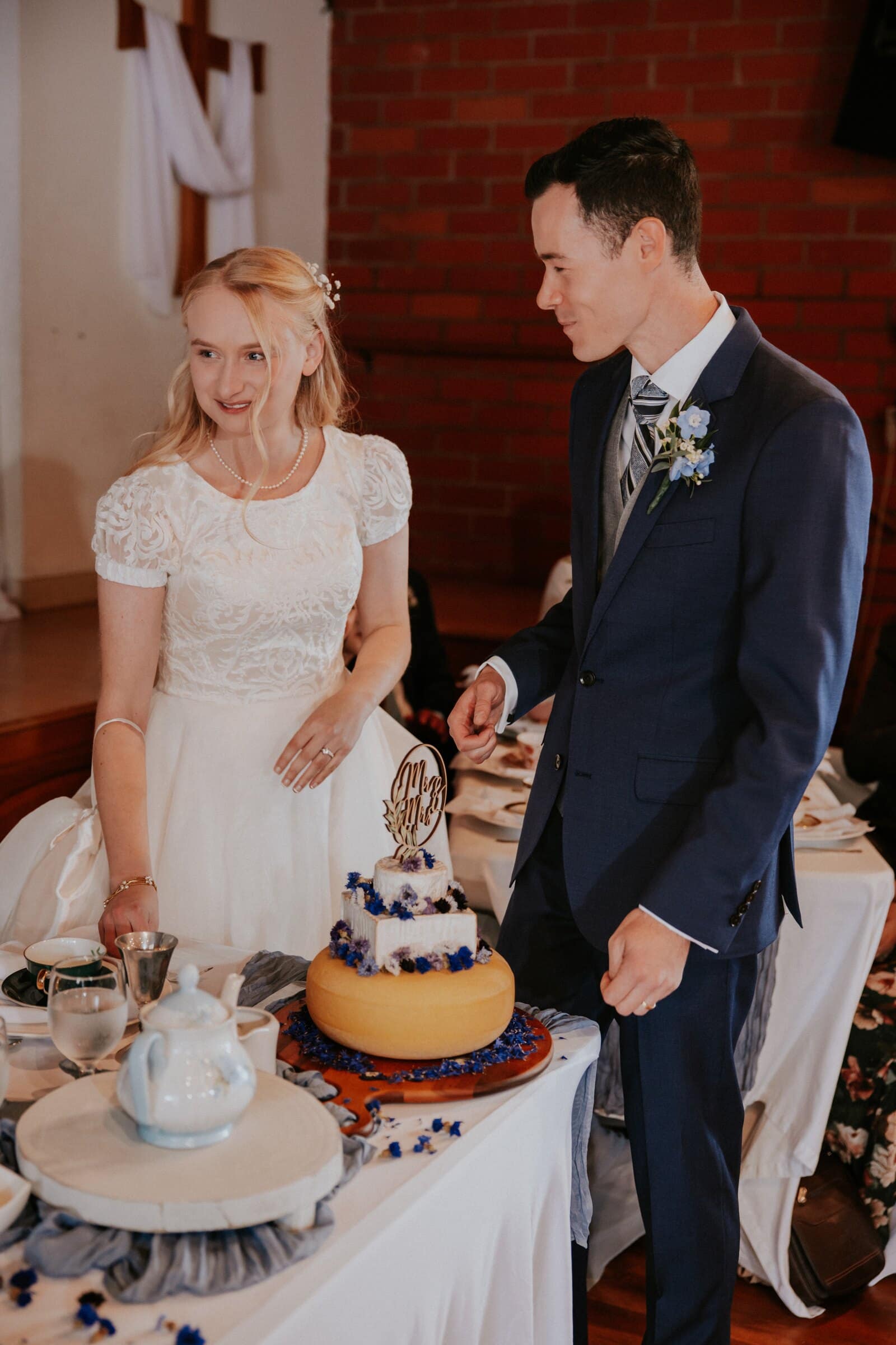 Morgan and Bryce cutting the cake