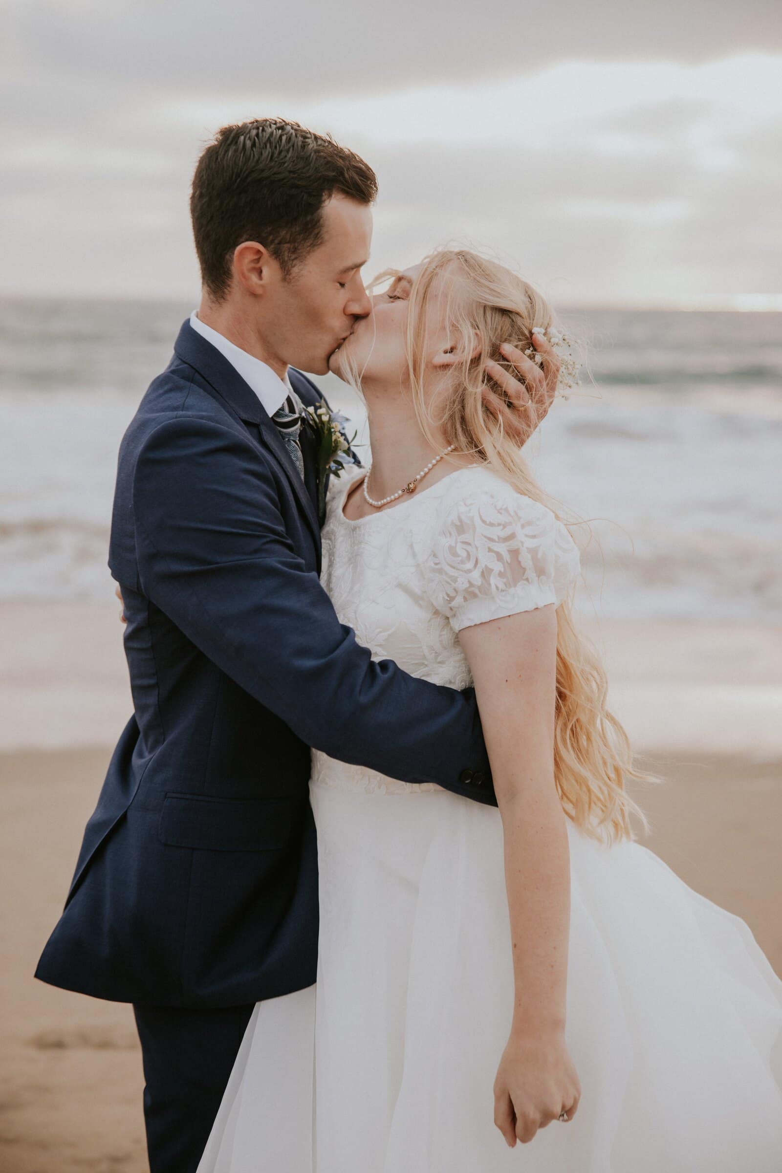 Bryce and Morgan kissing at the water's edge