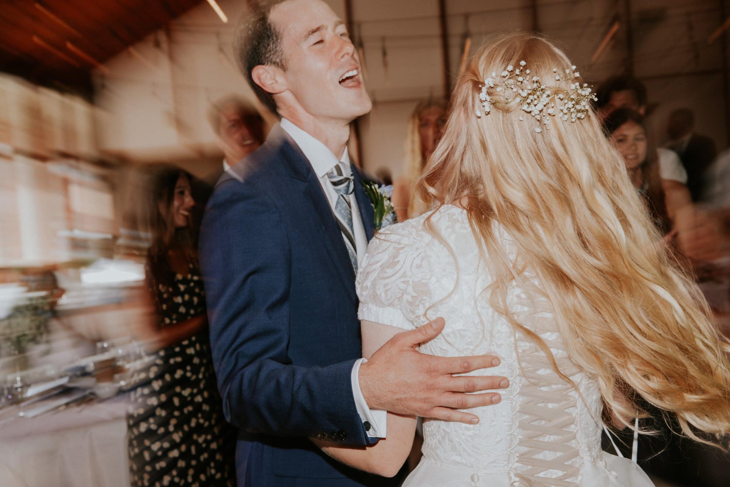 Bryce and Morgan dancing as the room blurs around them
