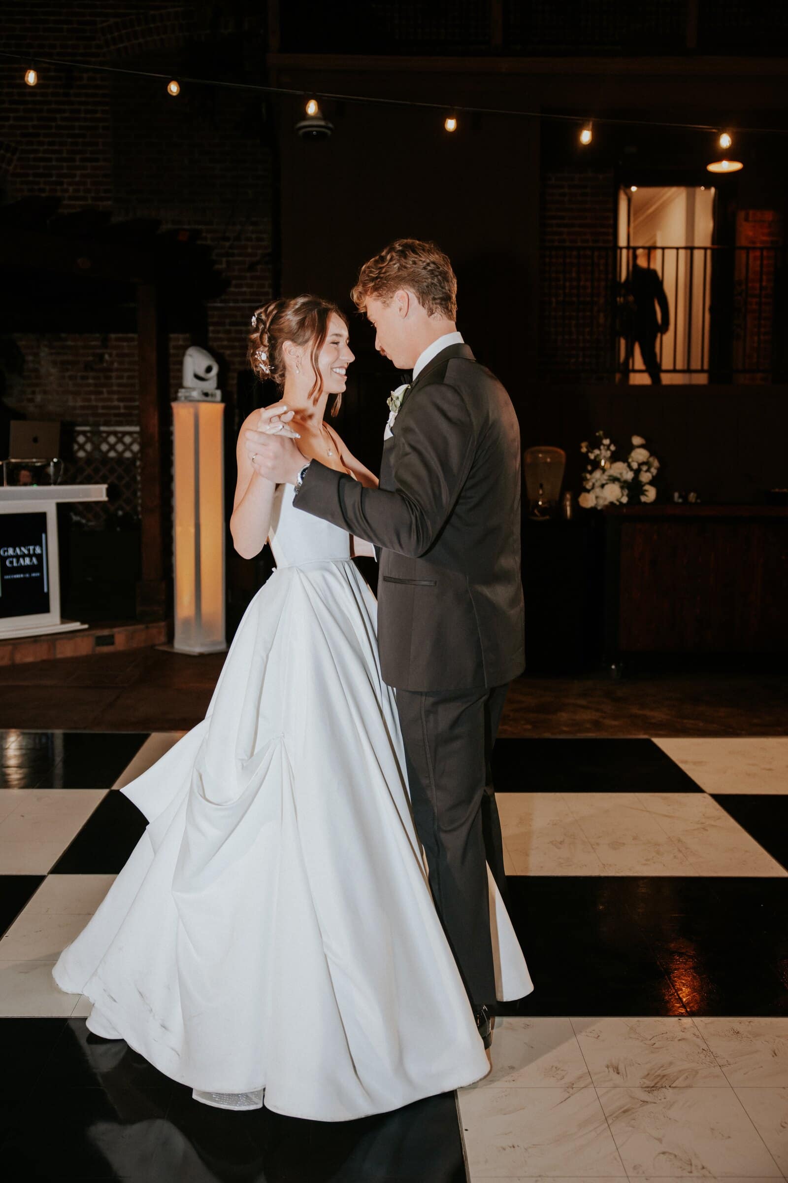 Clara and Grant's first dance on the checkered floor