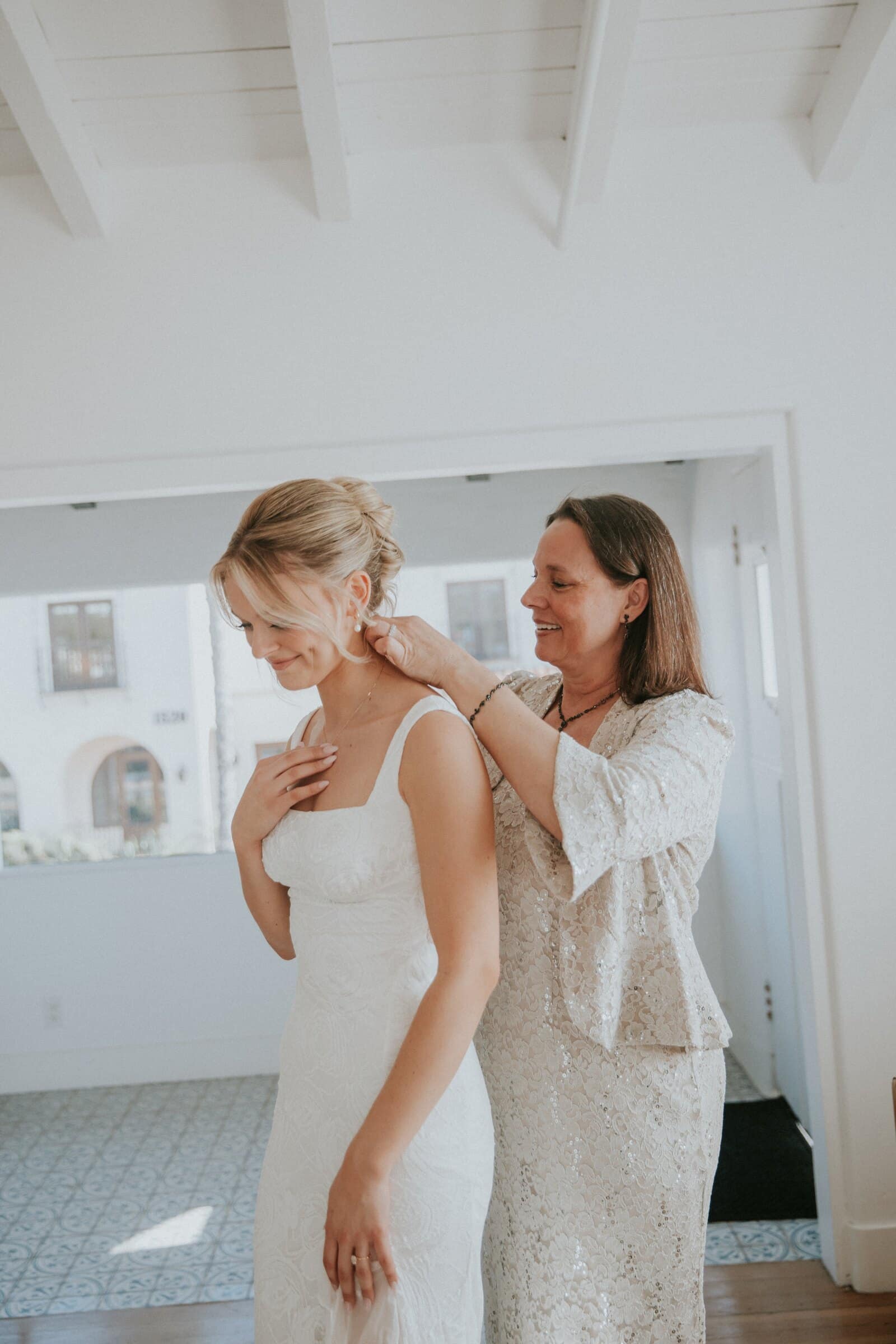 A woman fastening Leilani's necklace