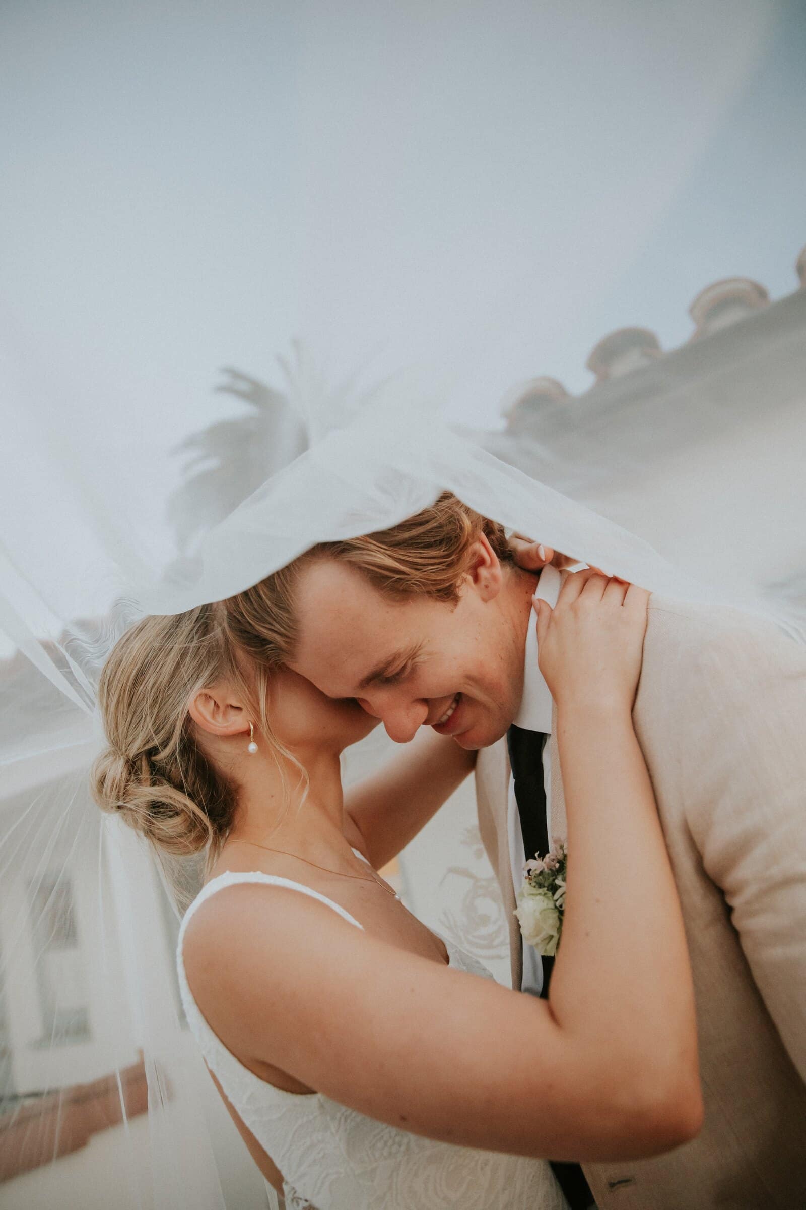 Leilani holding Micah close under her veil